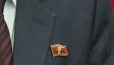 In a first, North Koreans seen wearing Kim Jong-un pins