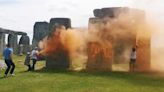 Stonehenge spray-painted orange by protesters calling for climate action