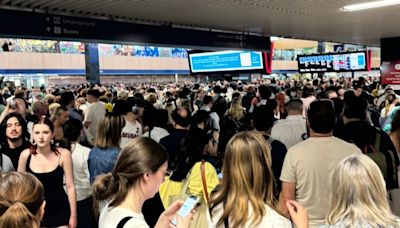 Chaos at Euston with passengers trapped on trains with 'broken air conditioning' and signal failure