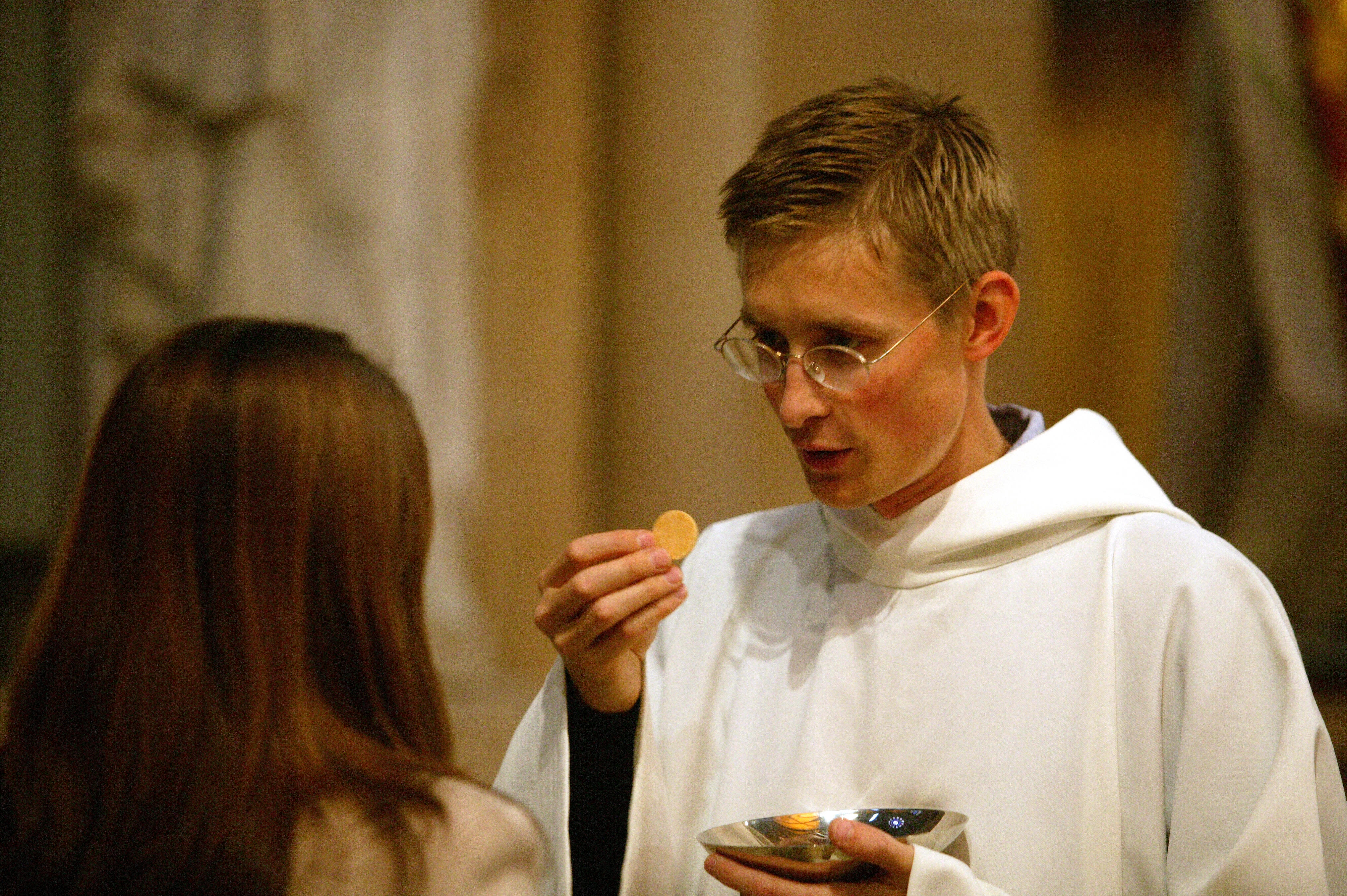 Florida Priest Bites Woman's Hand While Giving Out Holy Communion | iHeart