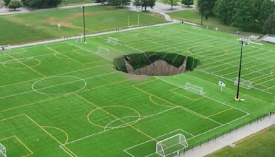 Massive sinkhole swallows Illinois soccer field after mine collapses