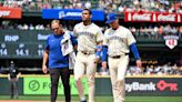 Mariners star Julio Rodríguez leaves game with apparent leg injury after crashing into outfield wall