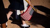 Girl Scout troops and Scouts of America placed American flags at Fort Bliss Cemetery Saturday