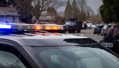 Springfield police rescue young man dangling from fence over I-5 with help of 988 call