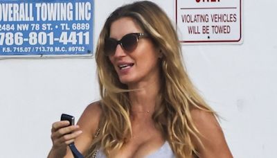 Gisele Bundchen bares ample cleavage and taut midriff in workout gear