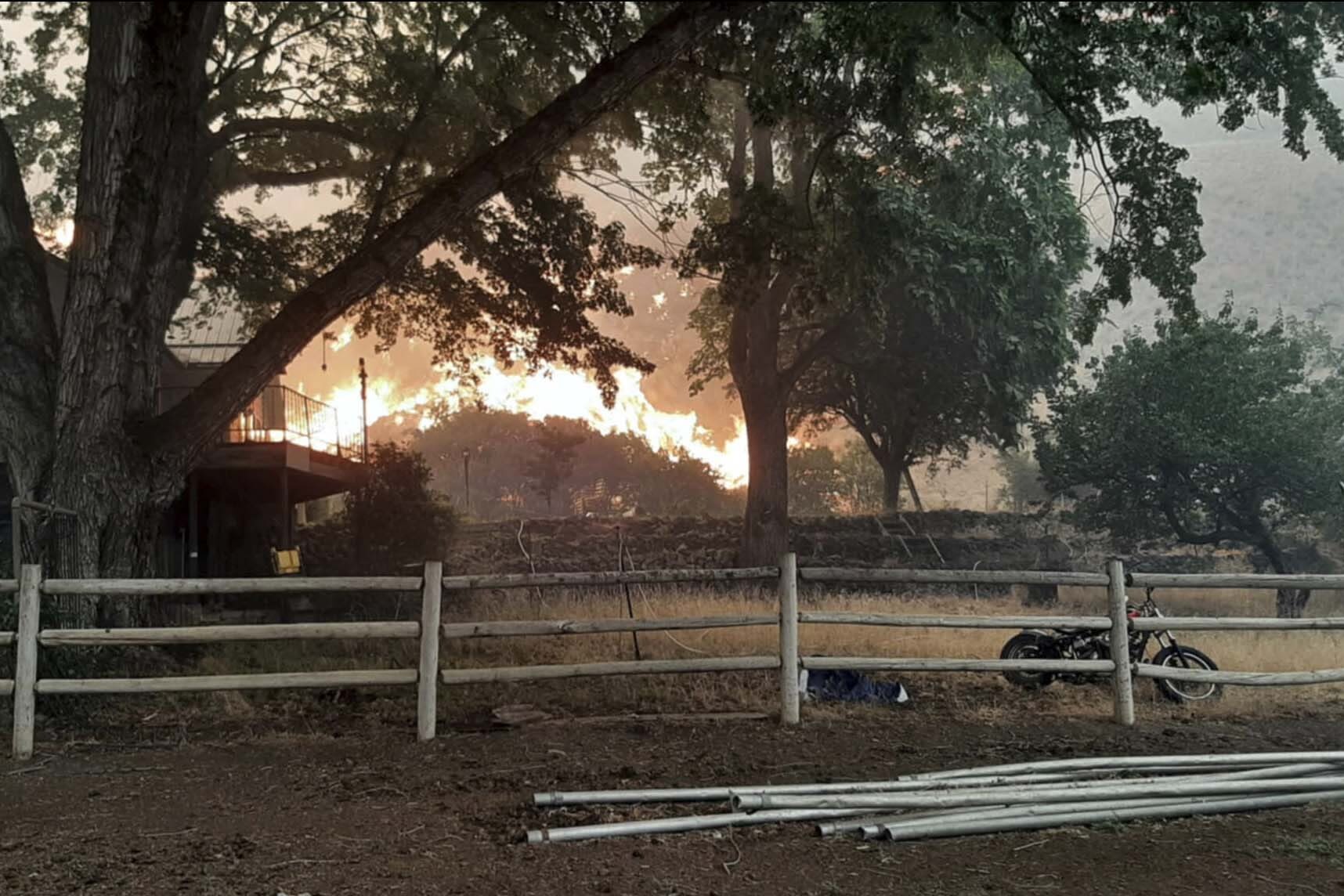 Wildfires prompt California evacuations as crews battle Oregon and Idaho fires stoked by lightning