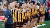 Brawl erupts over national anthem during AFL Anzac match at MCG
