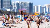 Spring Breakers Caught on Video Dumping Full Trash Cans Into the Florida Ocean