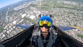Brittany Bell twists and turns through the air in fly-along with the Blue Angels