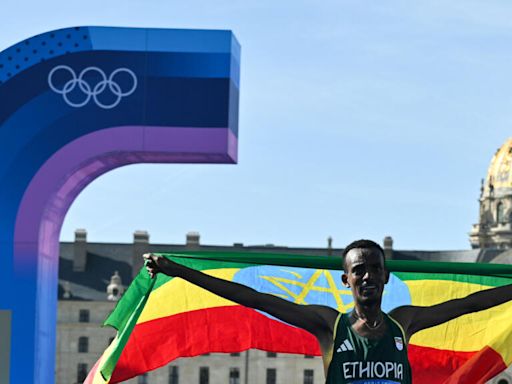 Ethiopia’s Tola wins Olympic marathon as France hope to dethrone US in basketball