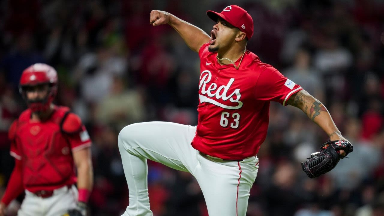 Santiago Espinal has 3 RBIs, Fernando Cruz pitches out of another jam and Reds beat Phillies 7-4