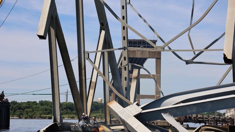 Crew remove large piece of steel from channel at Francis Scott Key Bridge collapse site