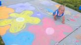 Dozens turn out to fill Anhder Park with art at the annual Chalk-the-Walk in Nibley