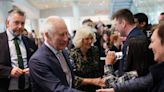 Smiling King Charles visits cancer centre on his return to public duties