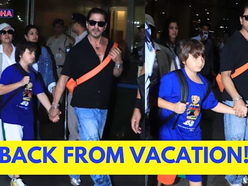 Shah Rukh Khan Holds AbRam's Hand As They Return From London With Gauri Khan | WATCH - News18