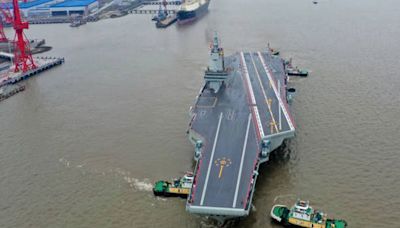 China's huge new aircraft carrier makes inaugural voyage as expert lays bare threat to US fleet