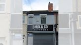 Approval denied for scheme to convert barbers shop into flats