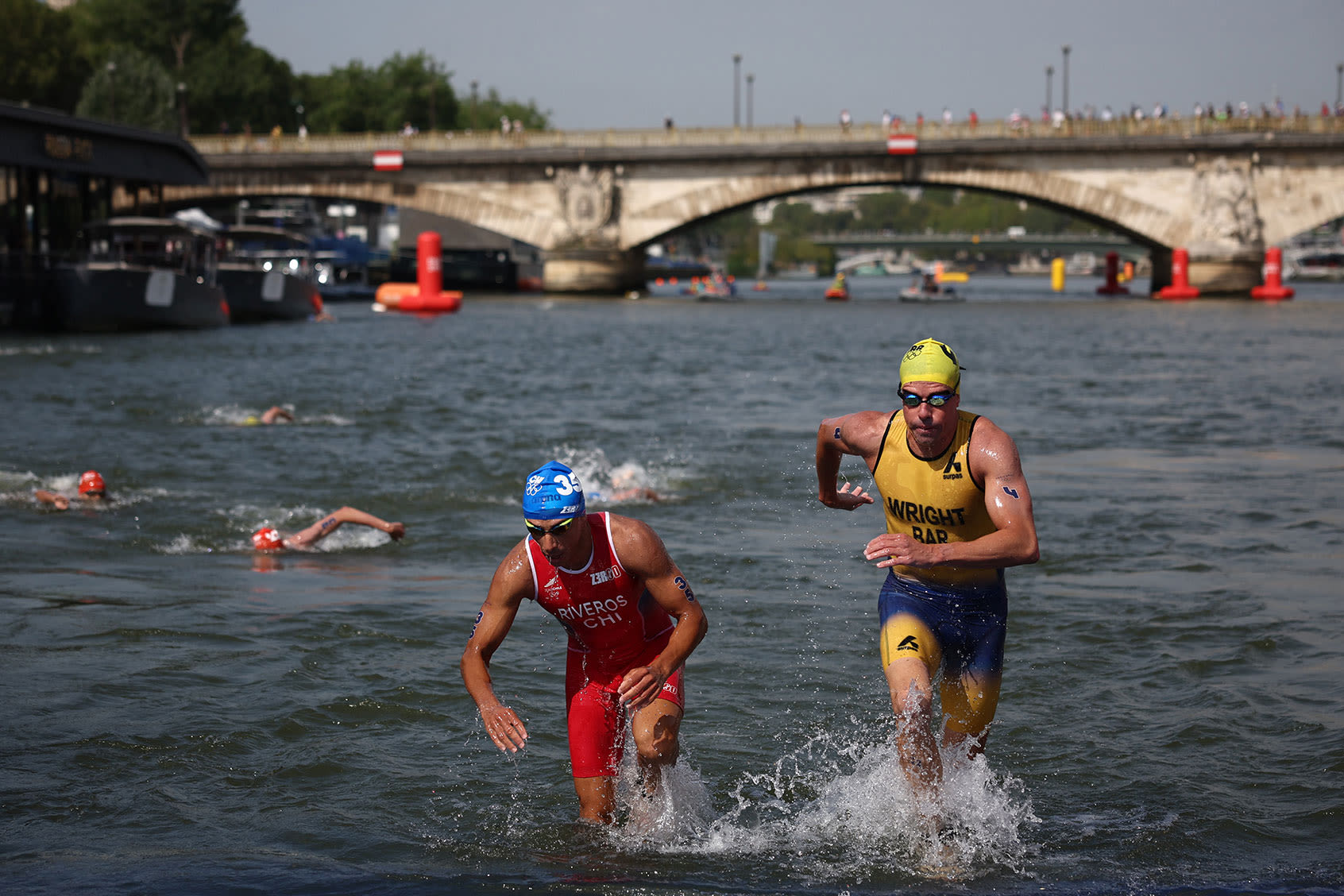 Olympic swimmers try to "flush out" Seine bacteria by drinking Coca-Cola