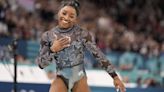 Simone Biles shakes off calf injury to dominate during Olympic gymnastics qualifying