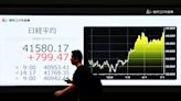 Asian stocks slide on rising trade tensions, yen climbs