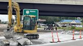 Contractors re-doing concrete panels recently installed on U.S. 75 interchange