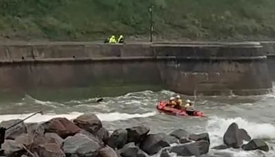 Coastguard rushes to rescue man stranded underneath sea wall