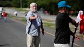 Elderly lawyer shoots dead two climate protesters blocking highway