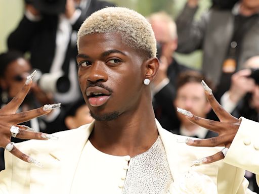 Lil Nas X Puts Modern Spin on Three-Piece Suit, Debuts Platinum Hair at Met Gala 2024