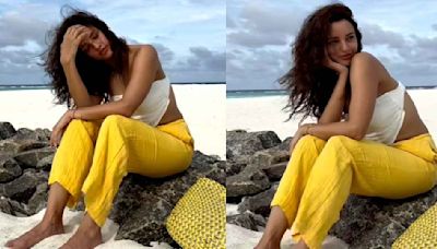 Triptii Dimri’s white bardot top and yellow pants fit is perfect for your next beach vacay