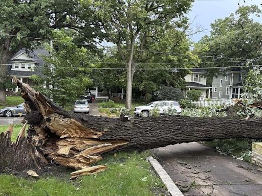 A dam fails after rain, wind, tornadoes pound the Midwest. The Chicago area is cleaning up
