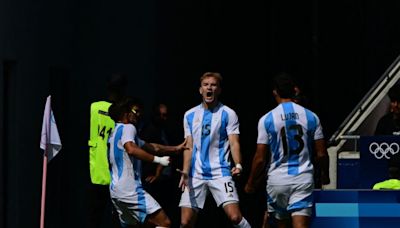 Argentina off the mark with win over Iraq; Spain through after victory