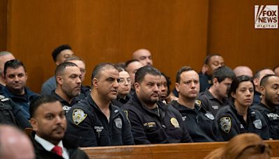 WATCH: NYPD officers fill Queens courtroom as suspect in policeman's death is arraigned
