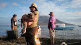 Rescuers Brave Indonesia Volcano Eruptions To Save Pets