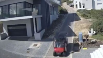 Moment runaway GOLF BUGGY flies down hill smashing through fence injuring 4