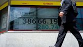 Stock market today: Asian shares edge lower after Wall Street sets more records