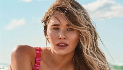 Gabriella Brooks wows in high cut slashed pink swimsuit in sexy beach photoshoot