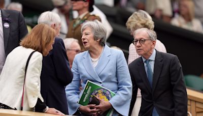 Theresa May and Romeo Beckham among spectators on drizzly day three of Wimbledon