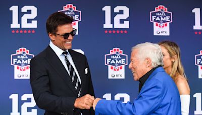 Patriots owner Robert Kraft buys signed Tom Brady rookie card at auction while sitting with Tom Brady