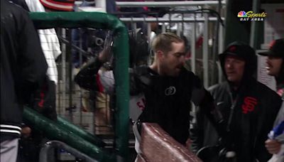 Giants catcher Murphy angrily slams gear after injuring knee in downpour