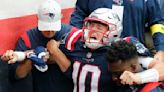 Patriots QB Mac Jones hops off field in pain after suffering leg injury in loss to Ravens
