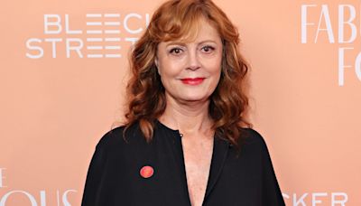 Susan Sarandon is a vision in all white as she cozies up to dashing A-lister