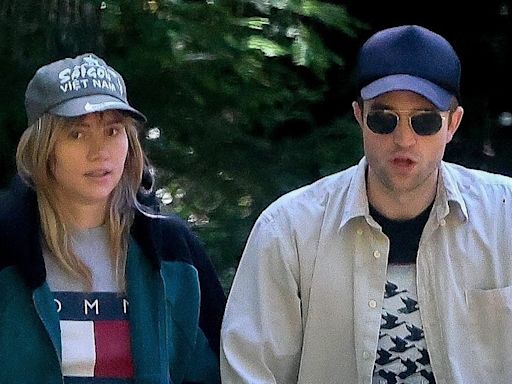 Suki Waterhouse and Robert Pattinson take a stroll with their daughter