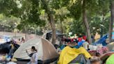 Waiting in limbo in Mexico City, asylum-seekers pin hopes on app