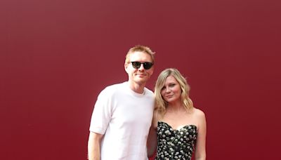 Kirsten Dunst Brings Brother Christian to Fashion Show for Rare Sibling Red Carpet Moment