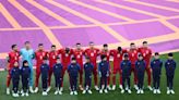 Soccer-Iran World Cup players silent as anthem plays, signalling protest support