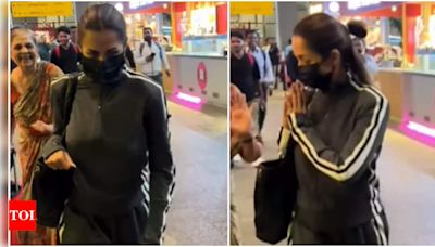 Malaika Arora wins hearts with a heartwarming gesture to an old woman at the airport | Hindi Movie News - Times of India