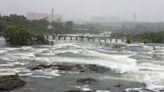 Vehicles submerged, fallen trees, and rescue boats on streets: Glimpses of torrential rains in Pune