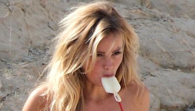 Jude Bellingham's model Wag stuns in red bikini as she cools off with ice lolly