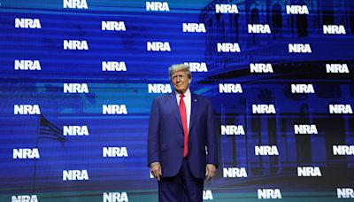 Trump addresses an embattled NRA as he campaigns against Biden’s gun policies
