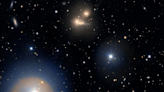 World's largest visible light telescope spies a galaxy cluster warping spacetime